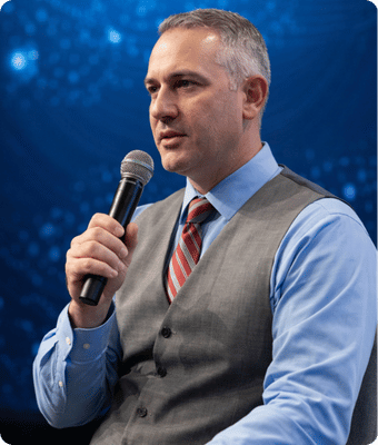 Timothy Prestianni seated with microphone at event, SEO and AI Search Optimization Consultant